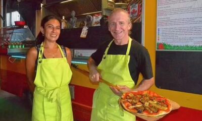 Philippe Schneider e a esposa, Nathalie Caboubassy, em pizzaria