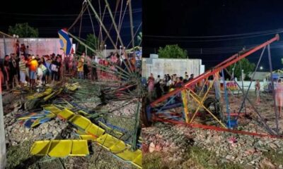 Imagem mostra os destroços de um brinquedo de parque de diversões, com ferragens retorcidas e assentos coloridos espalhados pelo chão. Populares observam o local do acidente à noite
