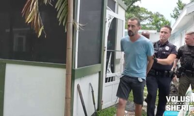 homem sendo preso