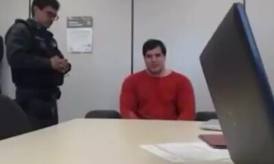 Renê da Silva Nogueira Júnior, de 47 anos, de roupa laranja da prisão