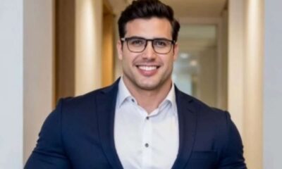 Renê da Silva Nogueira Júnior com terno e óculos