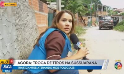 Dani Mazzei e cinegrafista Denilson se protegem durante ação policial em Salvador; cena foi registrada ao vivo