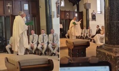 Imagem mostra Padre cantando.