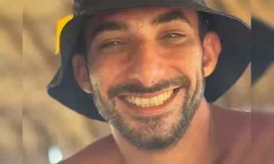 Foto de Adolfo Antônio Pires. Médico está de boné preto e sem camisa.