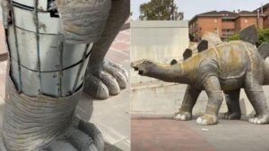 Imagem mostra estátua de dinossauro.